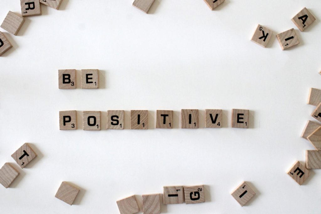 Be positive spelled out in scrabble tiles