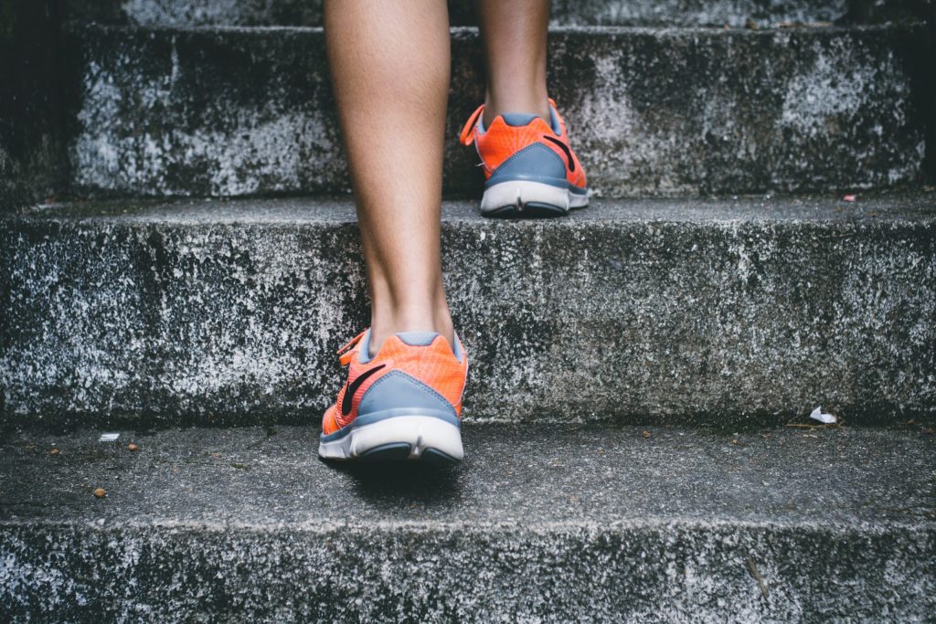 Focused in on feet climbing stairs