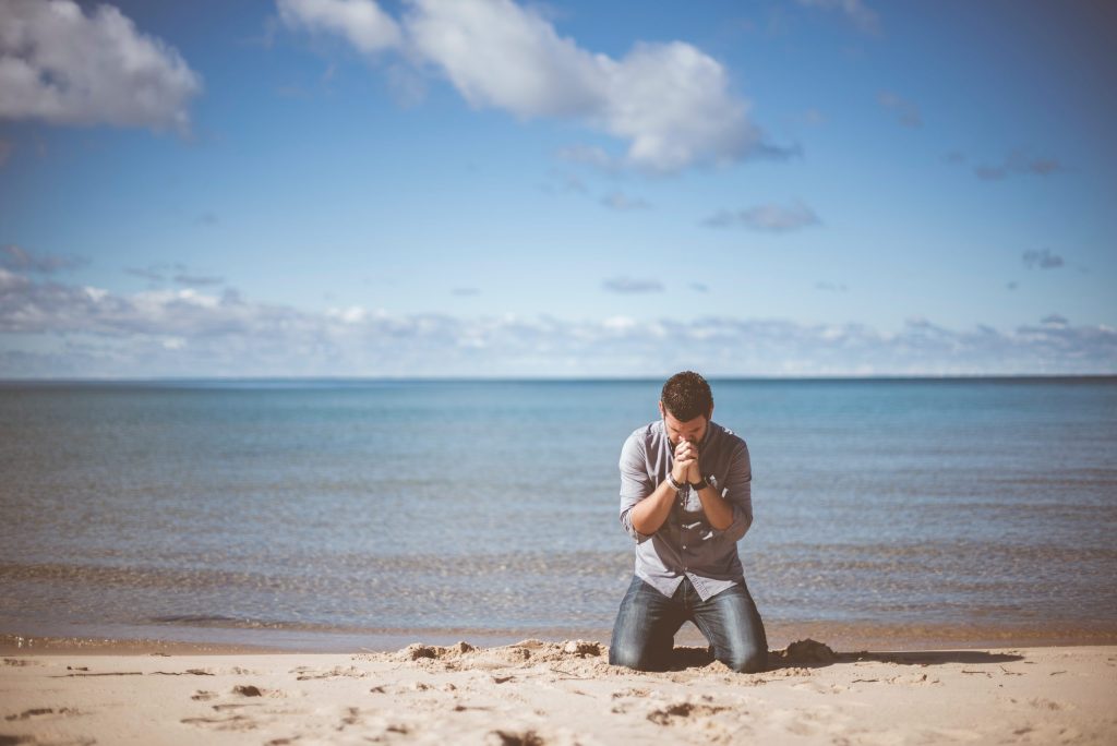 Man begging on the beach